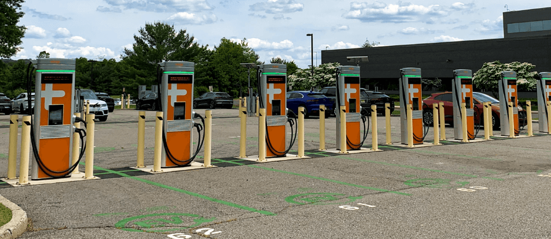 Photo of Eight Electric Vehicle Charging Stations in a Parking Lot
