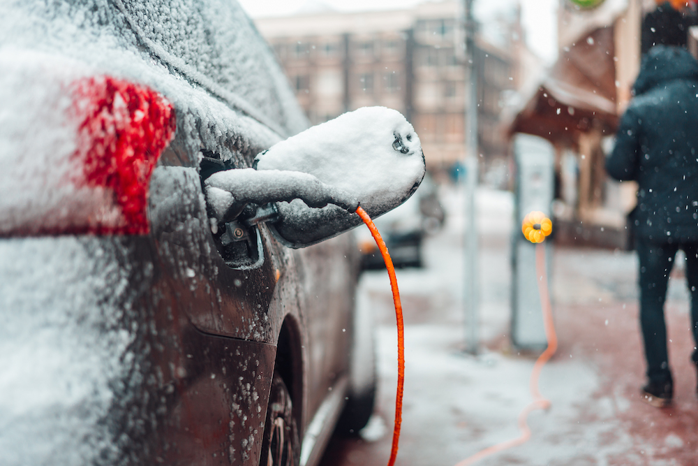 electric car charging in the winter snow